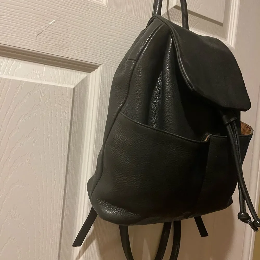 Tignanello Leather Black small Backpack string straps closure.
